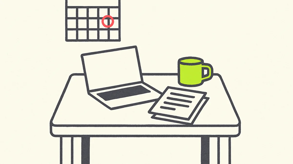 A kitchen table set up as a makeshift office with a laptop, a stack of paperwork, and a calendar showing a single day circled.
