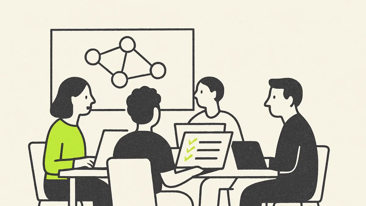 A community classroom setting with people at laptops around a table, one screen showing a simple course checklist.